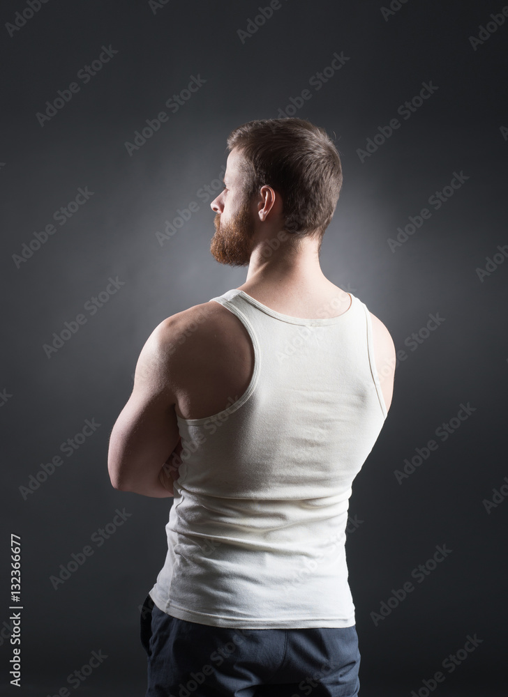 Strong, handsome and bearded man on black Strong, handsome and bearded man on black