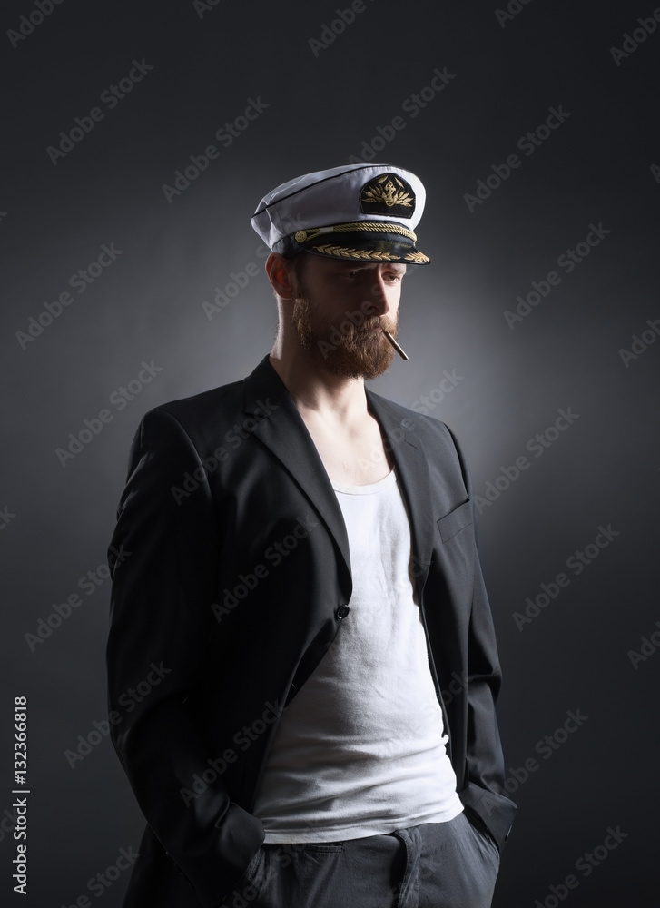Portrait of a handsome sailor on a dark background Portrait of a handsome sailor on a dark background