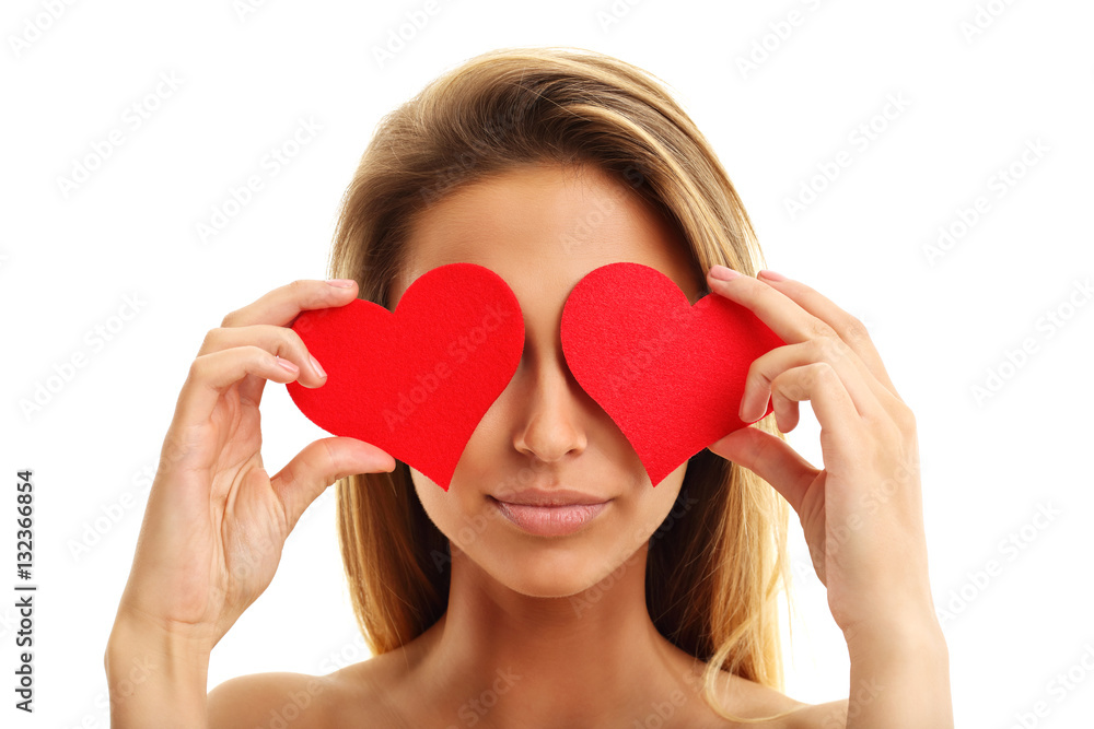 Beautiful woman covering eyes with hearts Beautiful woman covering eyes with hearts