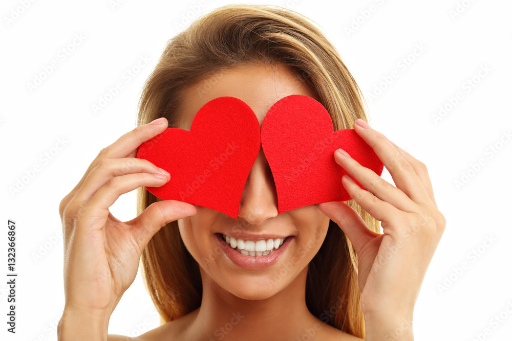 Beautiful woman covering eyes with hearts Beautiful woman covering eyes with hearts