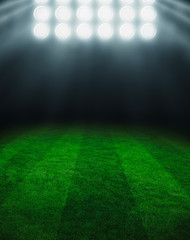 Illuminated football field at night