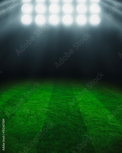 Illuminated football field at night
