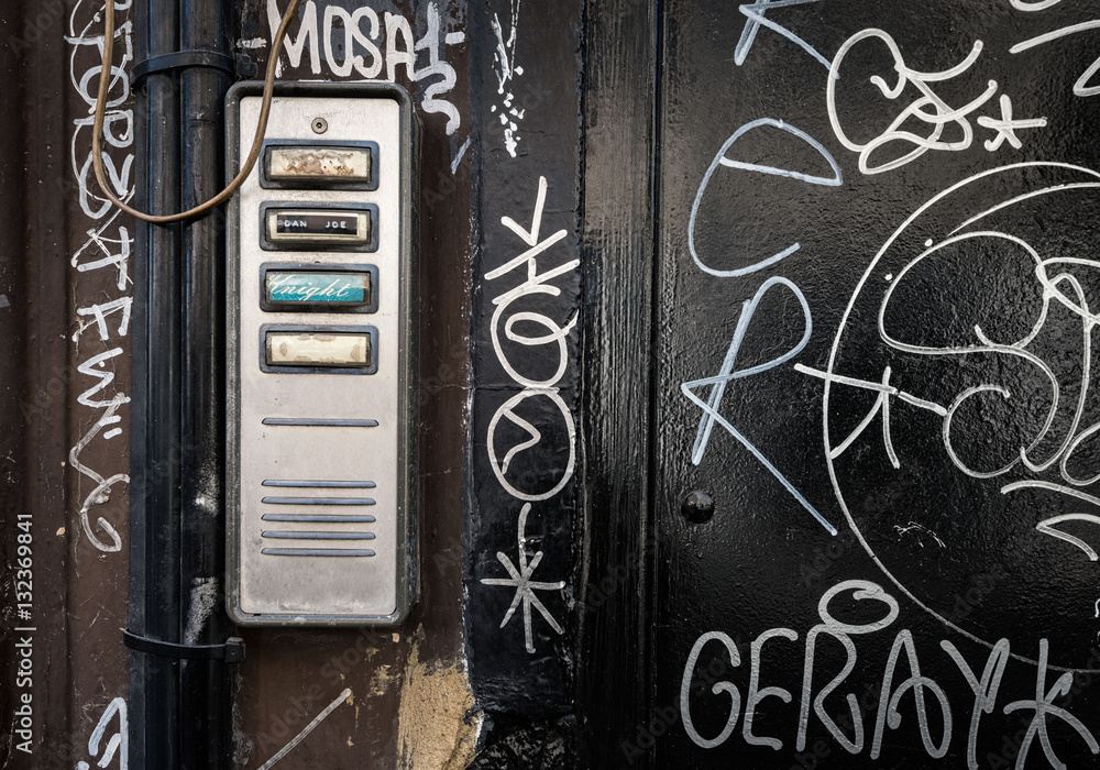 Door entry-phone with grafitti