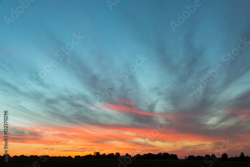 Dramatic sunset sky on countryside.