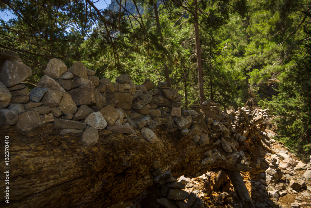 Samaria Gorge. Tourist tradition - a way of stones in the form of slides, in series or in the form of a pyramid. Island of Crete, Greece. Samaria Gorge. Tourist tradition - a way of stones in the form of slides, in series or in the form of a pyramid. Island of Crete, Greece.