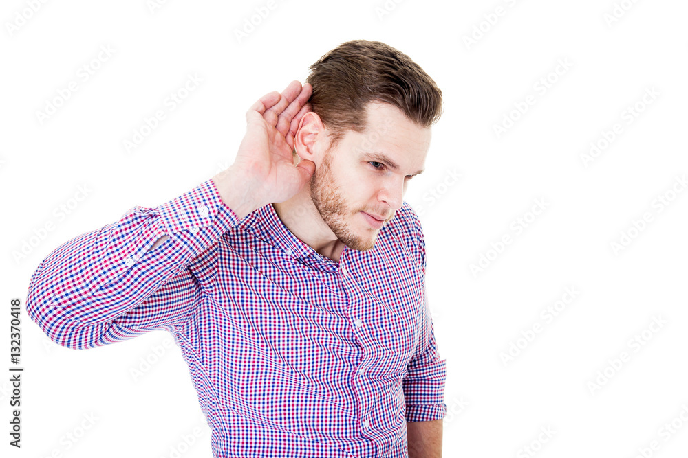 Man with impaired hearing struggling to hear frowning as he hold Man with impaired hearing struggling to hear frowning as he hold