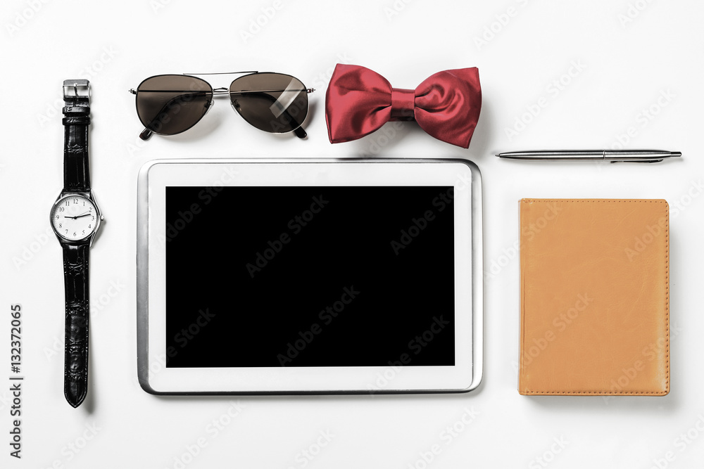 Gentleman kit of tablet watch glasses bow tie and notebook on wo