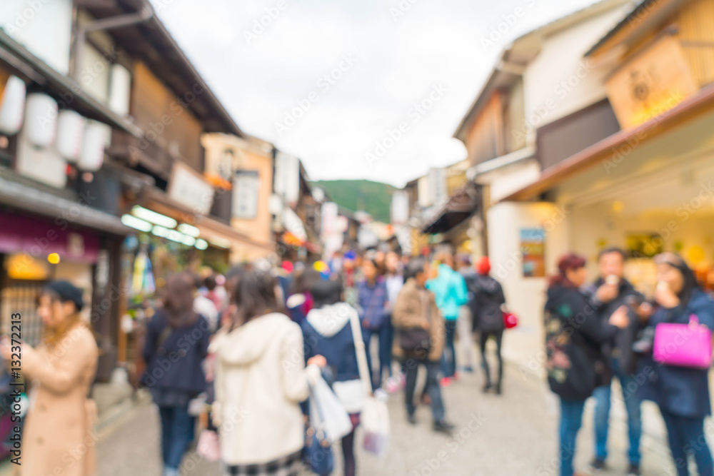 Blurred tourists walk on a street around Kiyomizu Temple. Kyoto