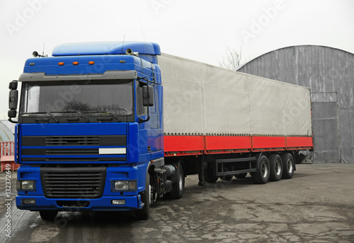 Truck near warehouse. Delivery and shipping concept.