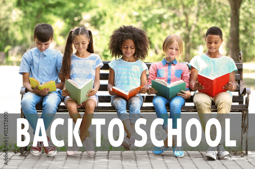 Cute kids reading books at ...
