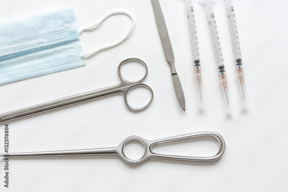 instruments for cosmetic surgery on white background top view instruments for cosmetic surgery on white background top view
