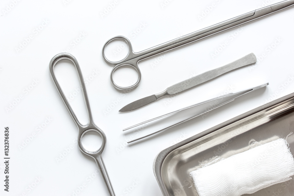 instruments for cosmetic surgery on white background top view instruments for cosmetic surgery on white background top view