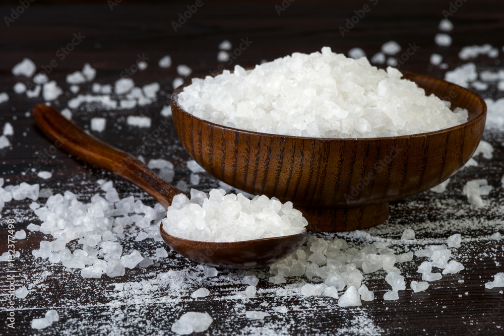 natural sea salt in a wooden bowl natural sea salt in a wooden bowl