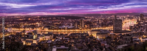 Cityscape from Mountain de Bueren in Liege Belgium at dusk. The river Maas leads through the scenery.