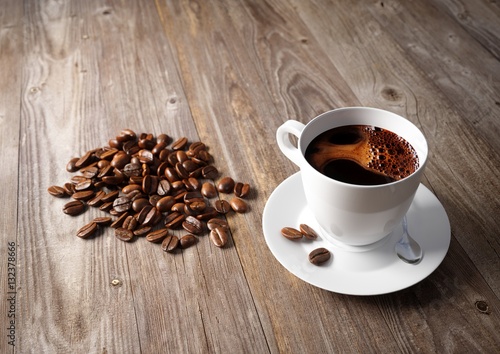 Coffee cup with roasted beans on rustic table