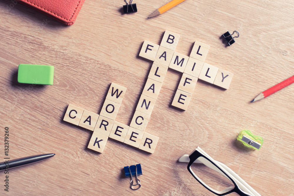 Conceptual keywords on wooden table with elements of game making crossword Conceptual keywords on wooden table with elements of game making crossword