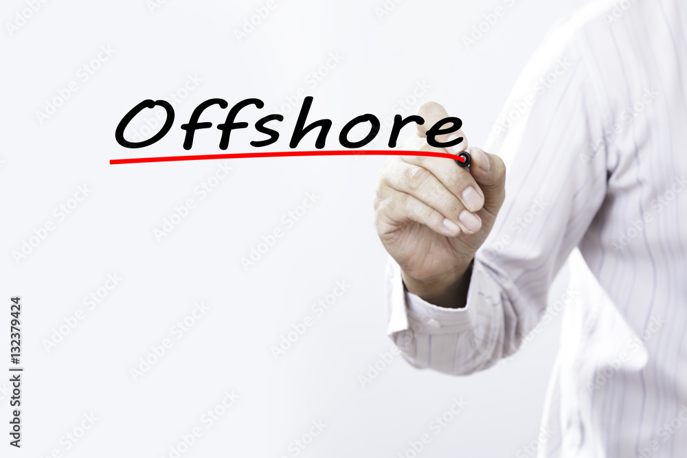 Businessman hand writing Offshore with red marker on transparent Businessman hand writing Offshore with red marker on transparent