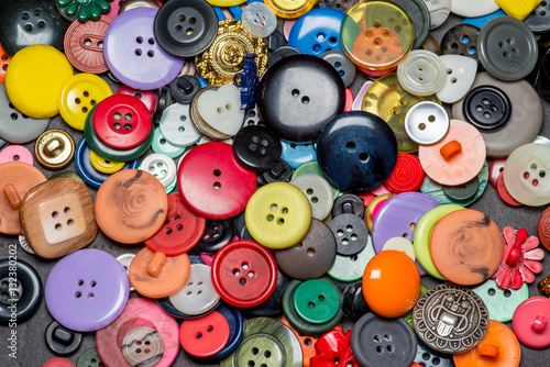 Collection of colorful sewing plastic buttons background 