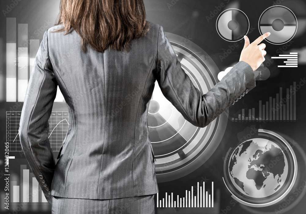 Fototapeta premium Businesswoman standing with back and pressing icon on media screen