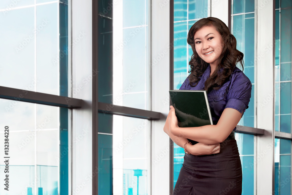 Portrait young asian business woman holding document Portrait young asian business woman holding document