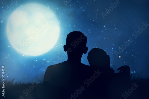 Silhouette of asian couple looking the moon