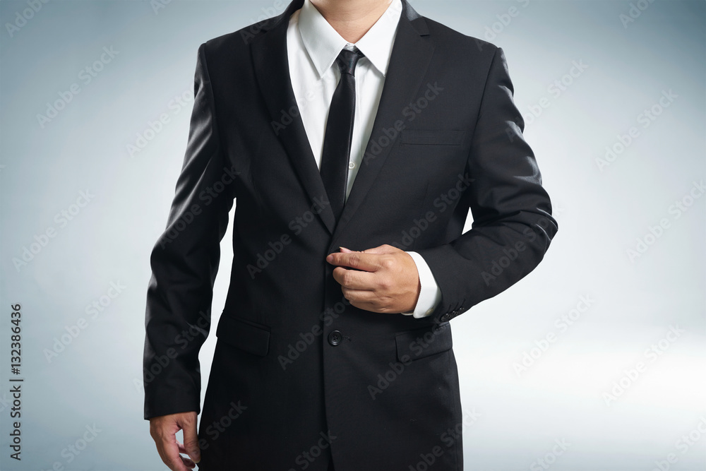 Confidence businessman in black suit , close up . Confidence businessman in black suit , close up .