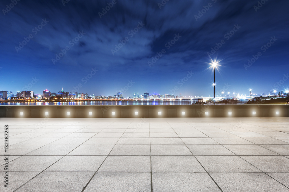 cityscape and skyline of modern city at night from floor