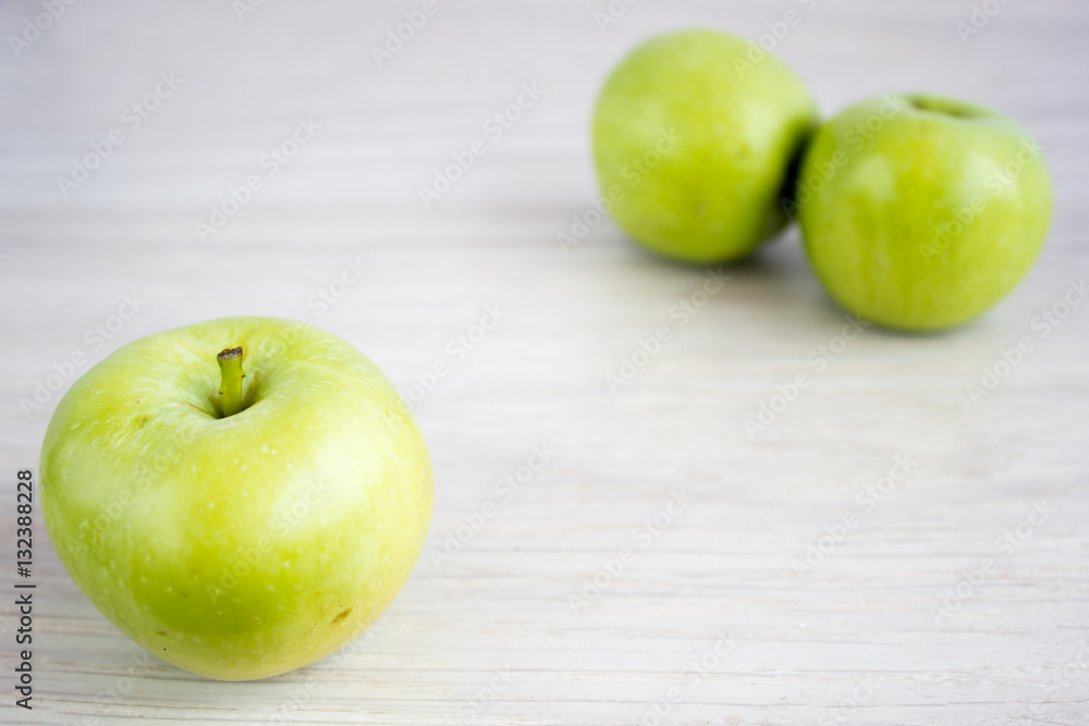 Three green apples on the table Three green apples on the table