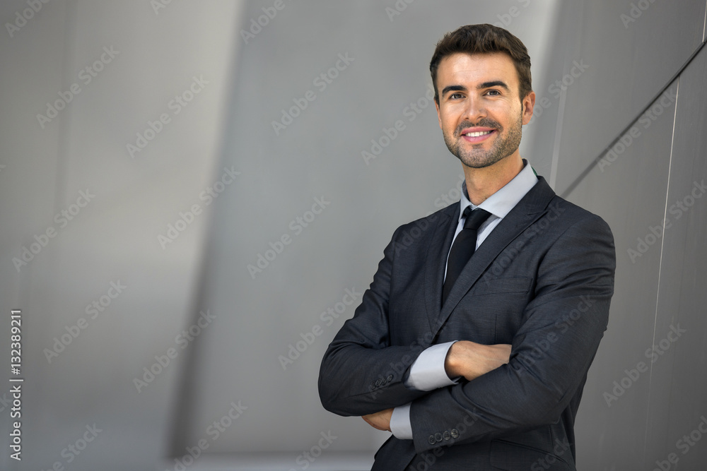 Smiling successful businessman at work cheerful bright and positive career executive Smiling successful businessman at work cheerful bright and positive career executive