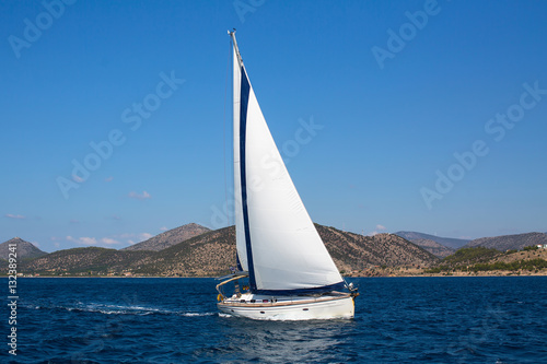 Luxury yachts. Sailing ship boats with white sails in the Sea.