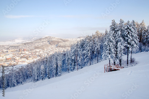 Winter snow mountain valley with village © nighttman