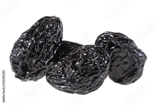 Smoked prunes isolated on a white background, close-up