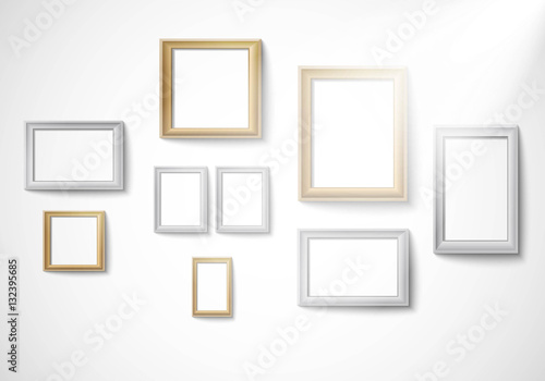 Fototapeta Naklejka Na Ścianę i Meble -  Blank gold and silver picture frame template isolated on wall with light Vector