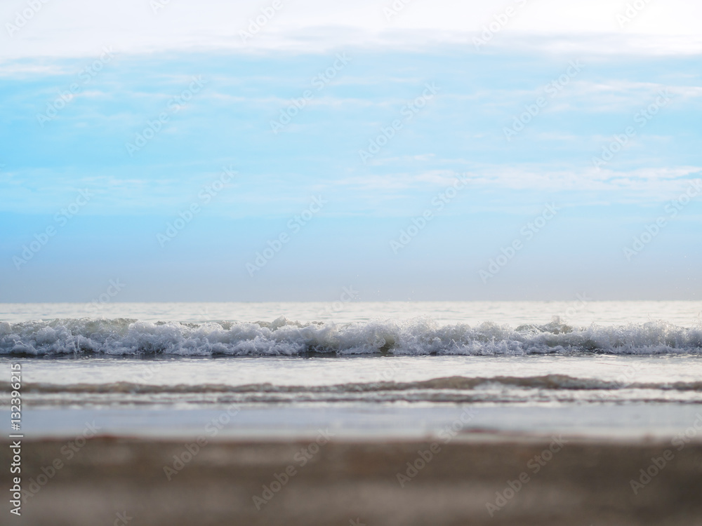 Fototapeta premium Nice sunset over sea beach with bright blue sky