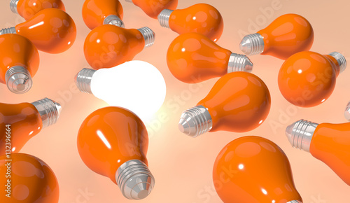 Fotografie single light bulb shining between oragge light bulbs