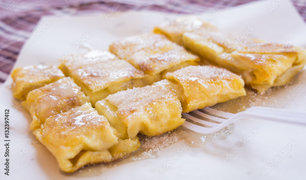 Dessert style of fried Roti with banana cooking on the street in Bangkok, Thailand
Dessert style of fried Roti with banana cooking on the street in Bangkok, Thailand