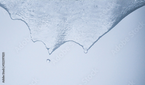 Obraz na plátně Transparent ice melting and dripping water