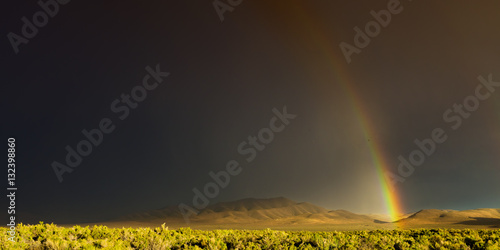 Desert storm with rainbow and dark skies in Nevada