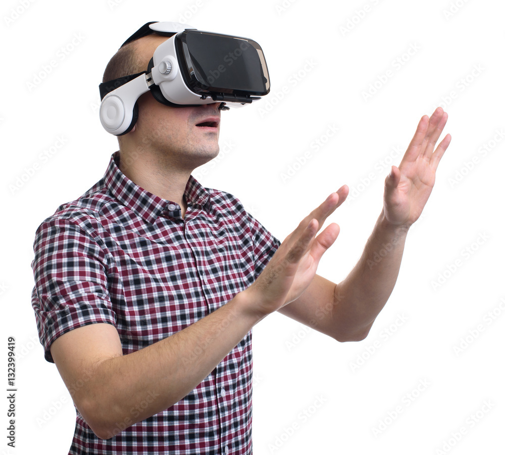 Fototapeta premium man in virtual reality through a VR headset.