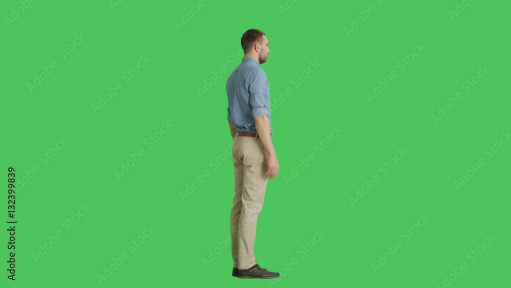 Long Shot of a Handsome Man. Camera Rotates Around Him. Background is Green Screen. Shot on RED Cinema Camera 4K (UHD). Long Shot of a Handsome Man. Camera Rotates Around Him. Background is Green Screen. Shot on RED Cinema Camera 4K (UHD).