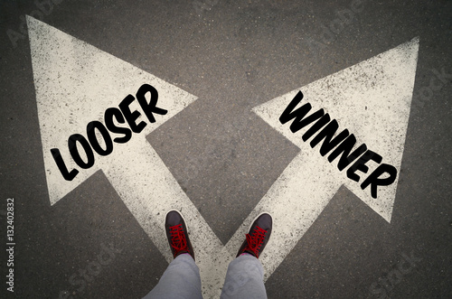 WINNER versus LOOSER written on the white arrows photo