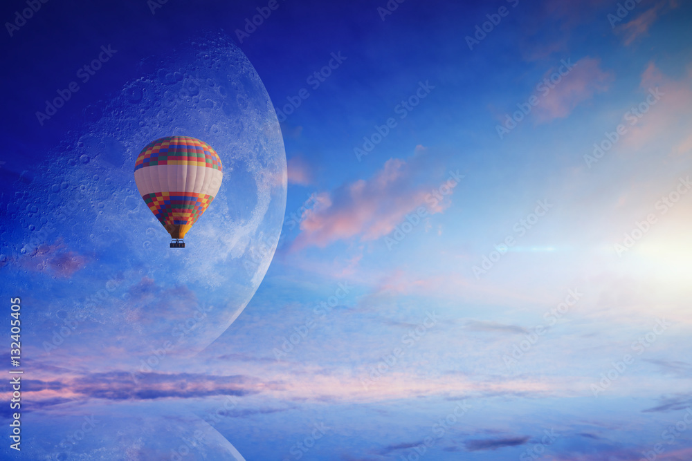 Hot air balloon in blue sky with rising full moon Stock Photo | Adobe Stock