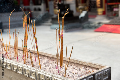 Yellow incense sticks burning at Wong Tai Sin , Chinese Temple, Hong Kong photo