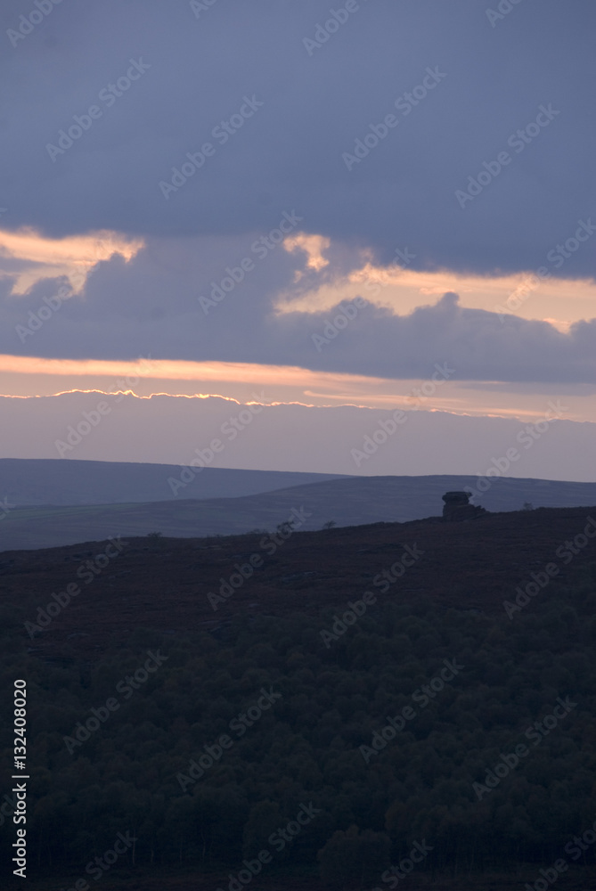 Evening sun set lights up the clouds over the Peak District, Derbyshire, UK