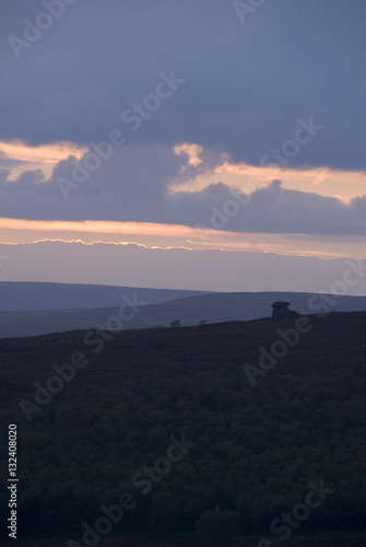Evening sun set lights up the clouds over the Peak District  Derbyshire  UK
