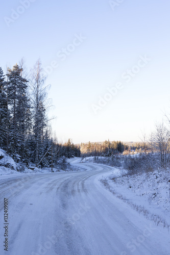 Curvy and slippery road in Finland. Image taken on a cold winter morning. © Jne Valokuvaus