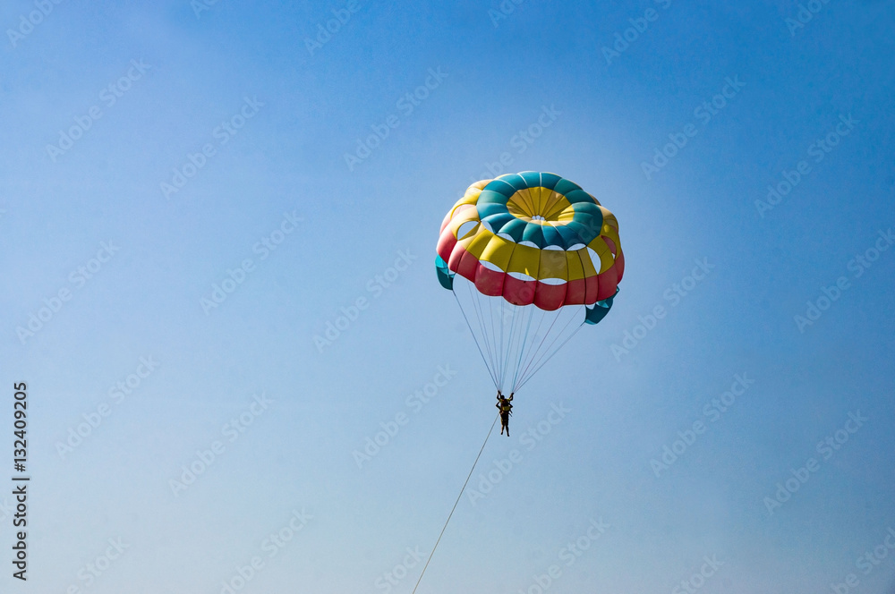 Parachutist in the blue sky on a sunny day Parachutist in the blue sky on a sunny day