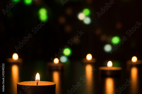 Candles with light in a romantic decoration and defocused lights. Bokeh effect