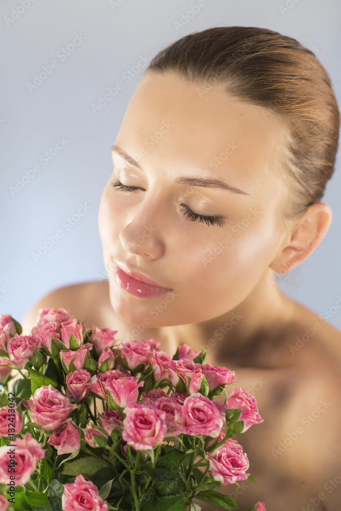 Brunette woman with natural make up and flowers. highlights isolated Brunette woman with natural make up and flowers. highlights isolated