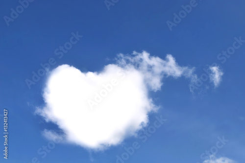 Heart cloud symbol on blue sky background